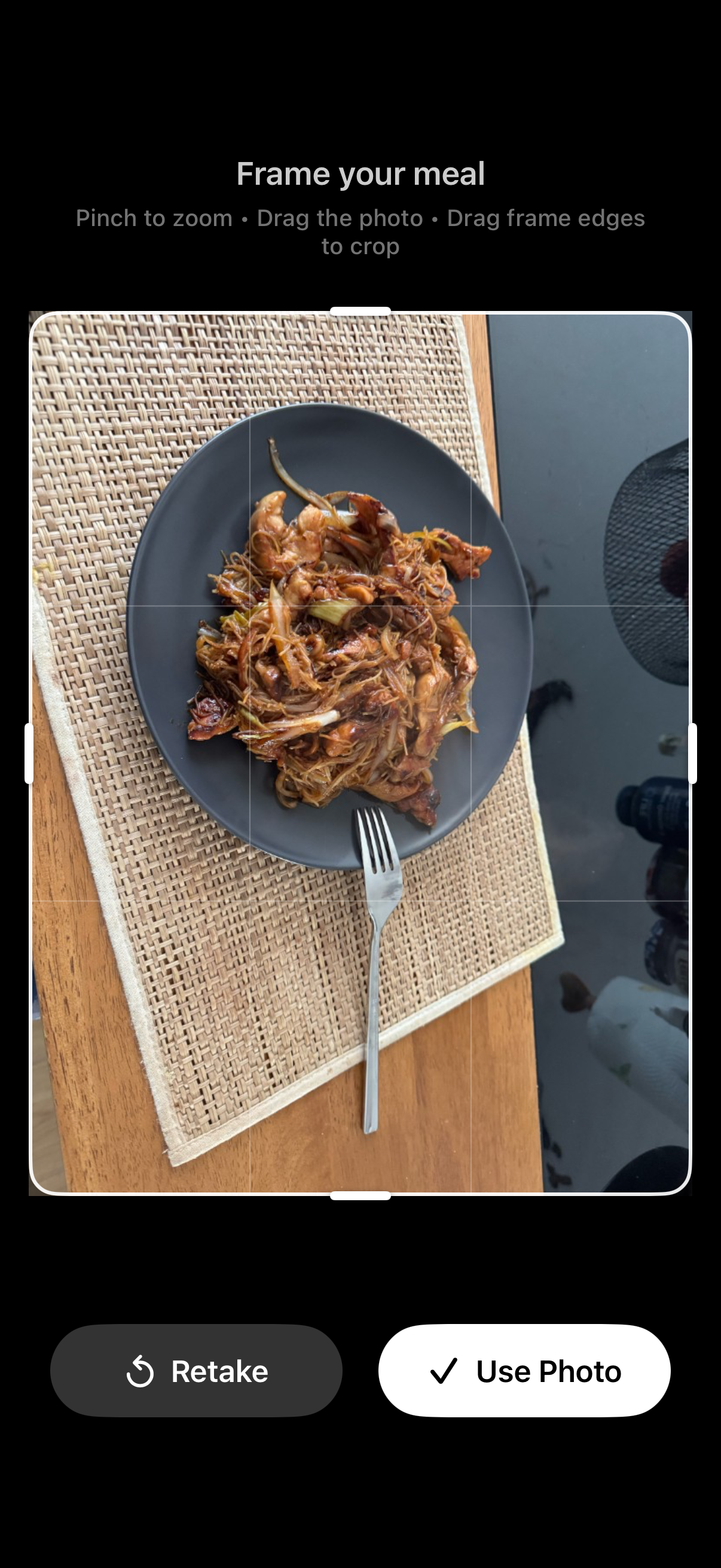 FuelForm photo preview showing a sample noodle meal with Frame your meal, Retake and Use Photo controls
